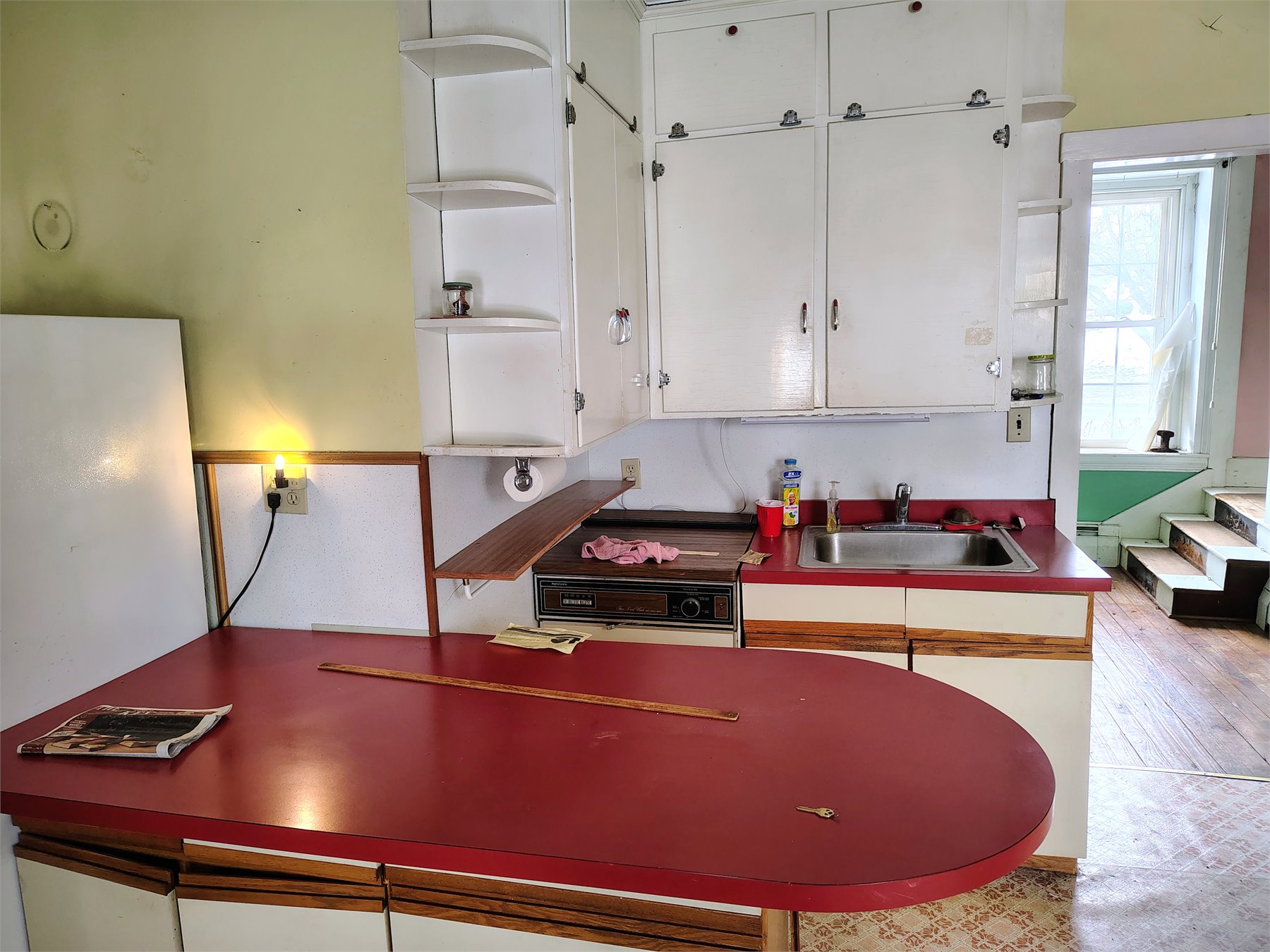 Kitchen before renovation, forward view